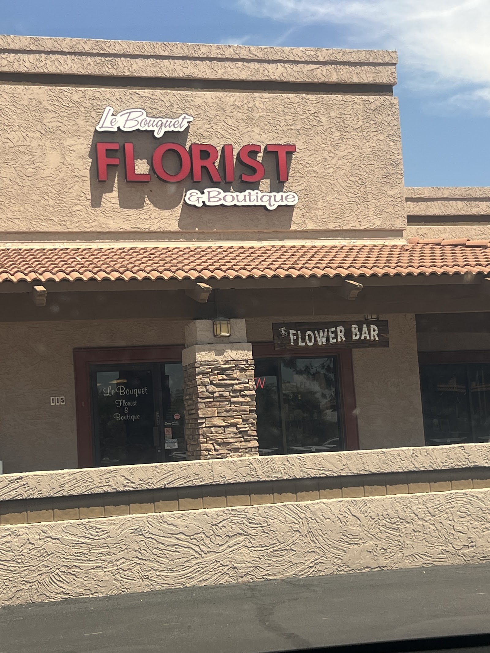 A signature garden-style arrangement by Le Bouquet, lush with seasonal blooms